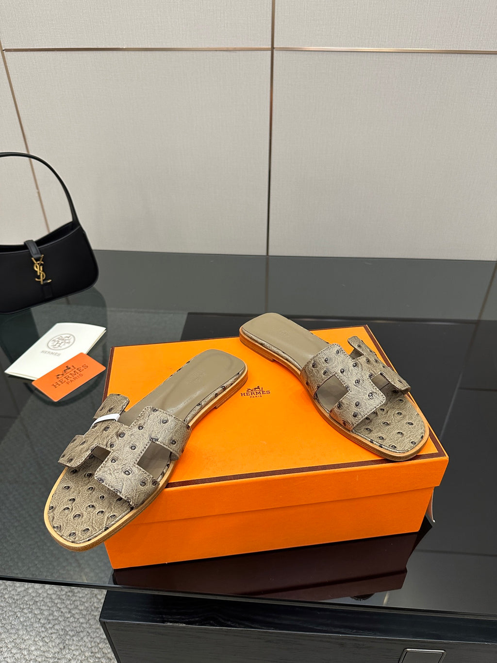Hermes womens slide sandals, light gray perforated suede with wide strap and metal buckle