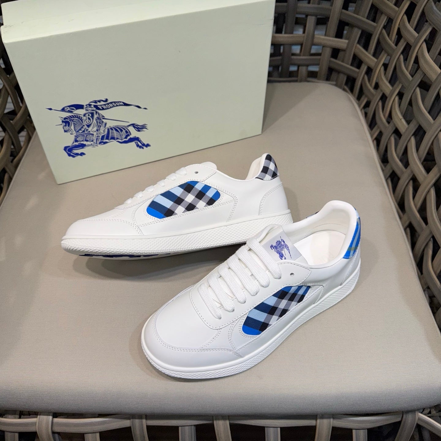 Burberry white sneakers with blue check side panels and textured sole