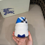 Burberry white sneaker heel with blue check panel and rubber tread