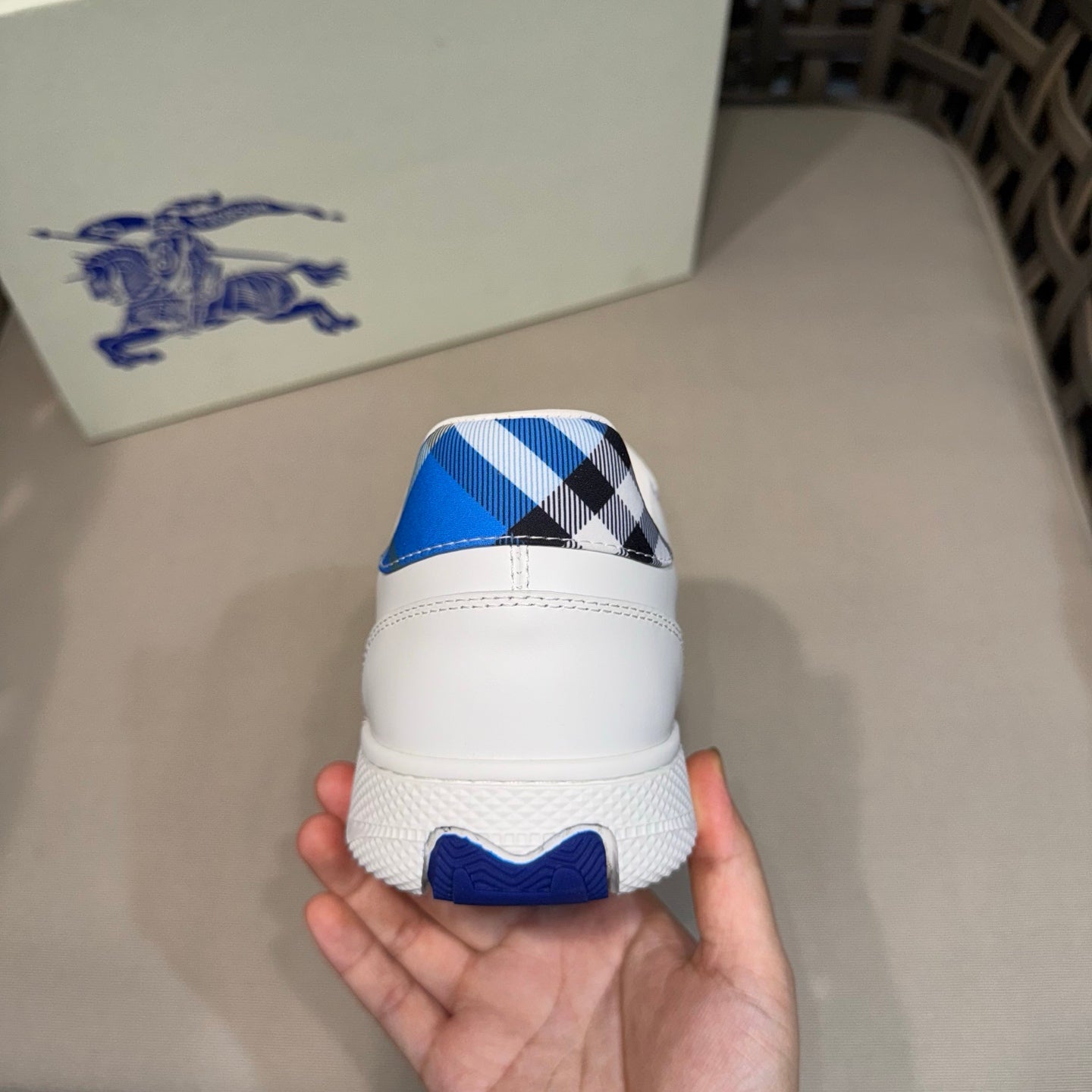 Burberry white sneaker heel with blue check panel and rubber tread