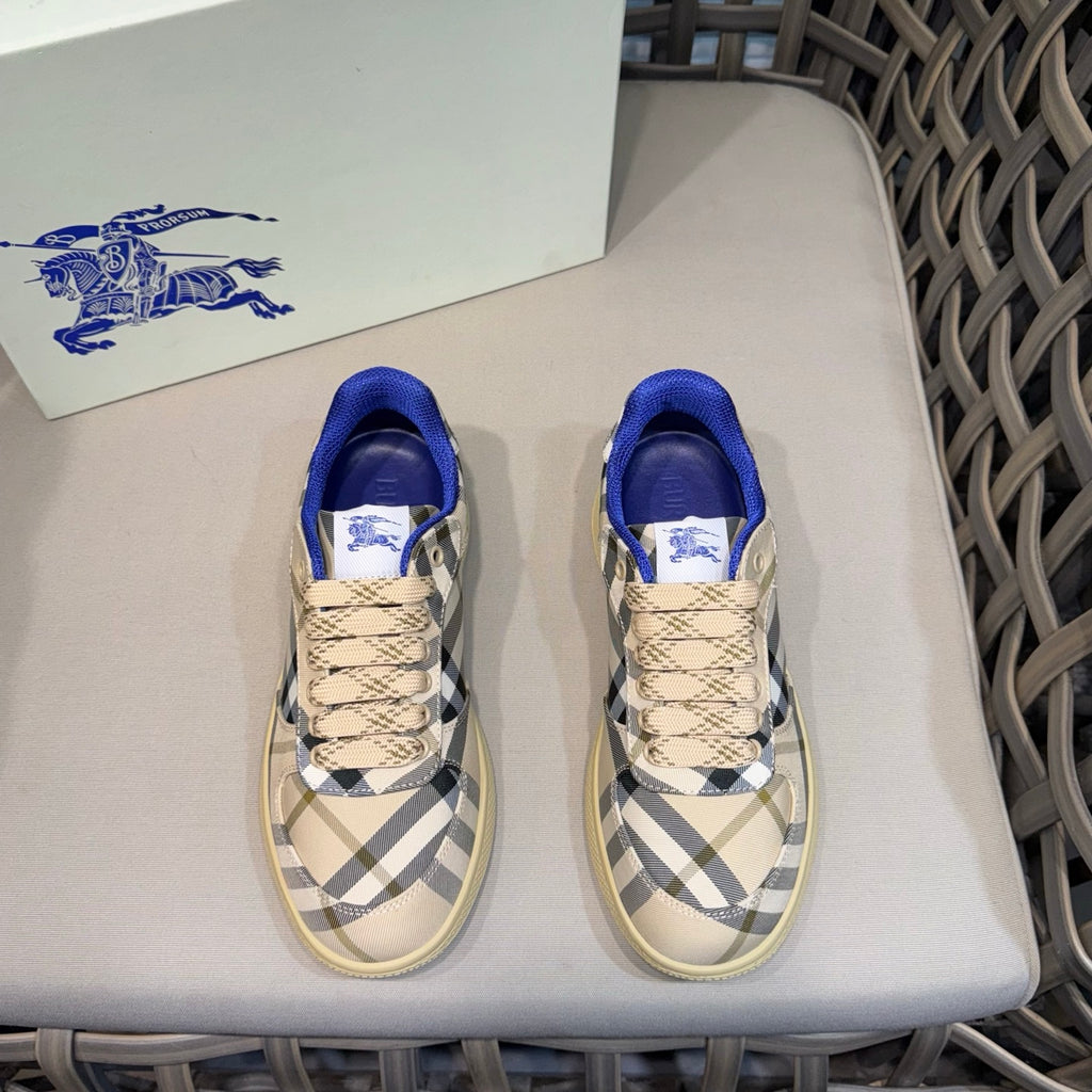 Low-top sneakers with blue collar, beige laces, and navy-and-white check panels