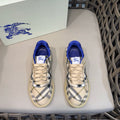 Low-top sneakers with blue collar, beige laces, and navy-and-white check panels