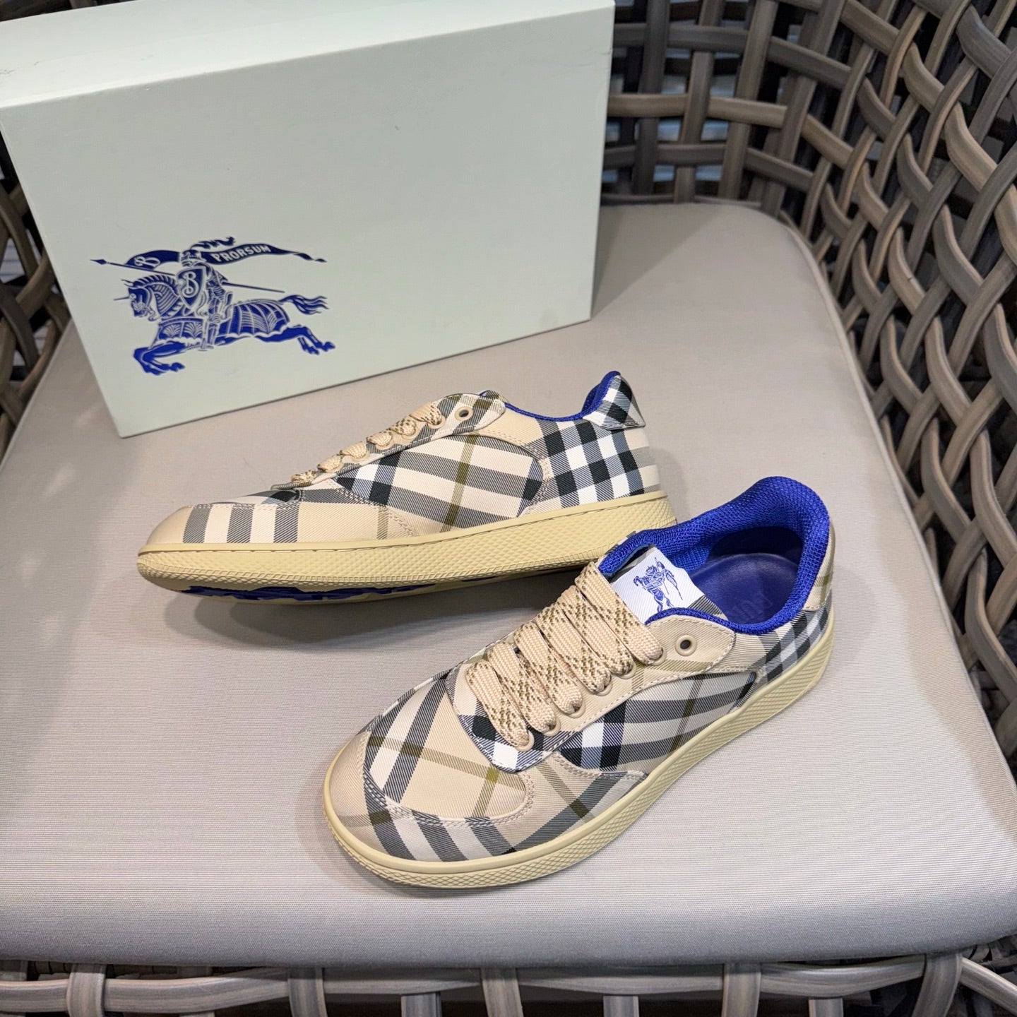 Sneakers with beige-and-navy check canvas, blue inner lining, and lace-up front