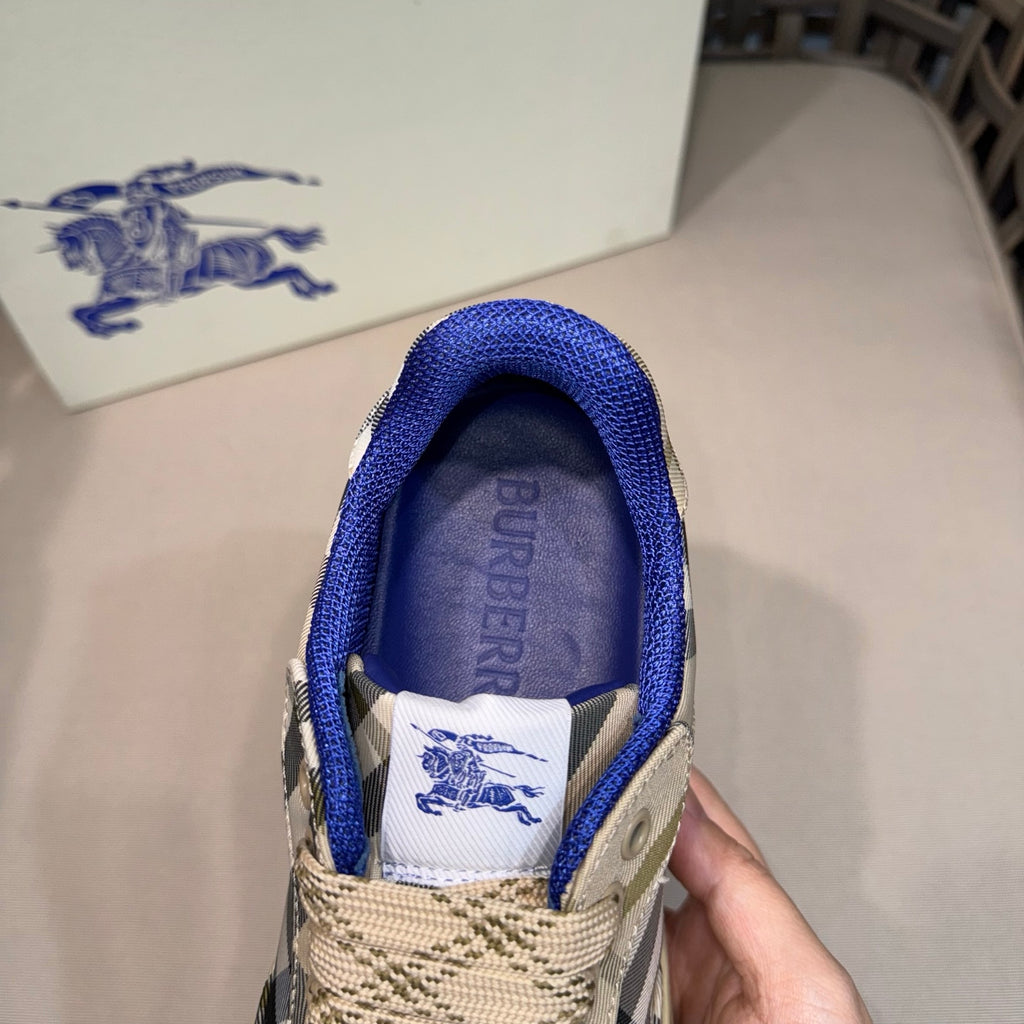 Sneaker interior view with blue lining and white label featuring Burberry text