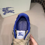 Sneaker interior view with blue lining and white label featuring Burberry text