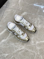 Unisex sneakers pair, white mesh with gold logo details and white laces