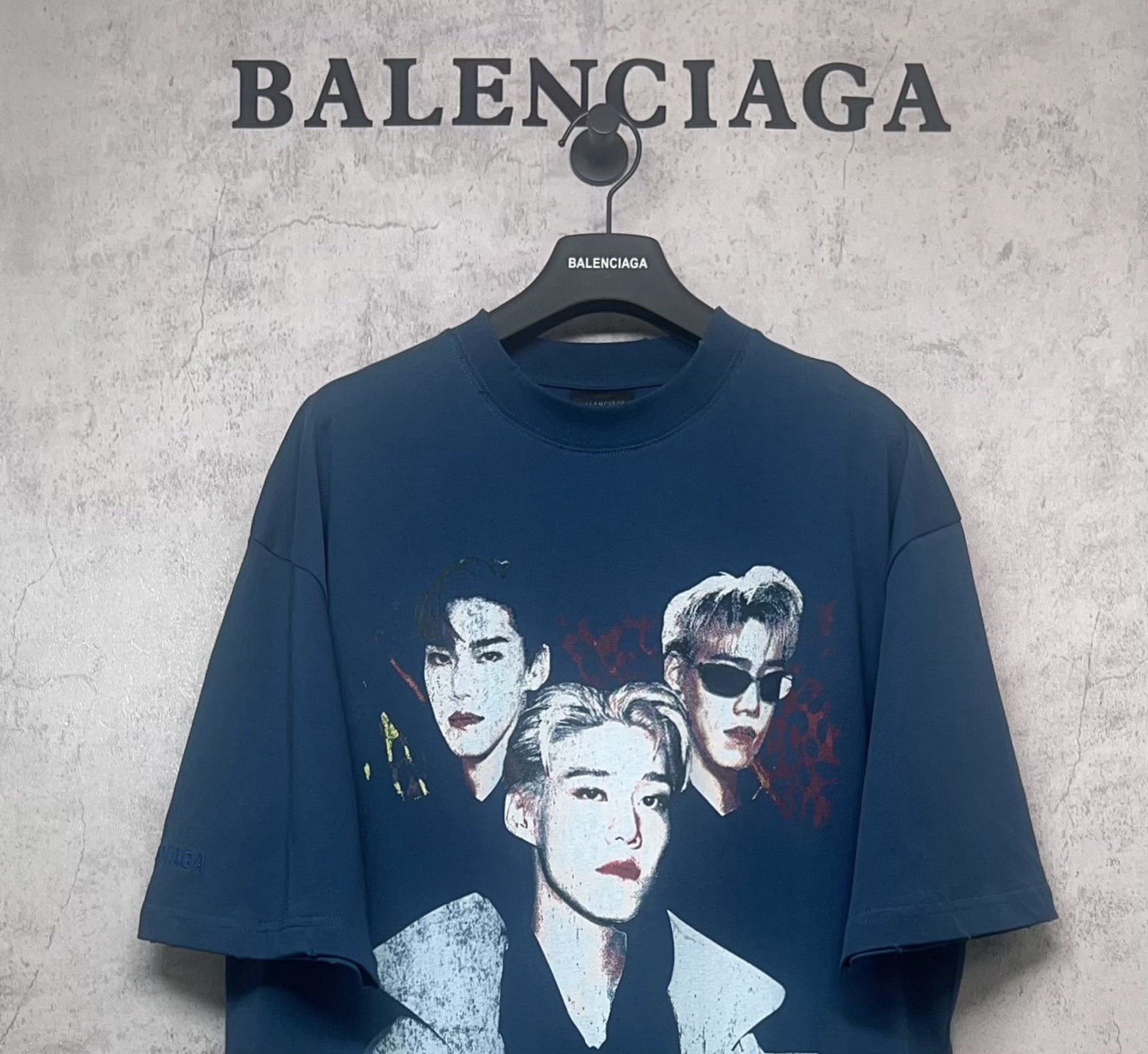 Blue graphic T-shirt with large three-portrait print