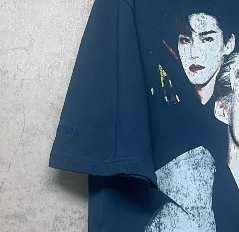 Blue graphic T-shirt sleeve with portrait graphic detail