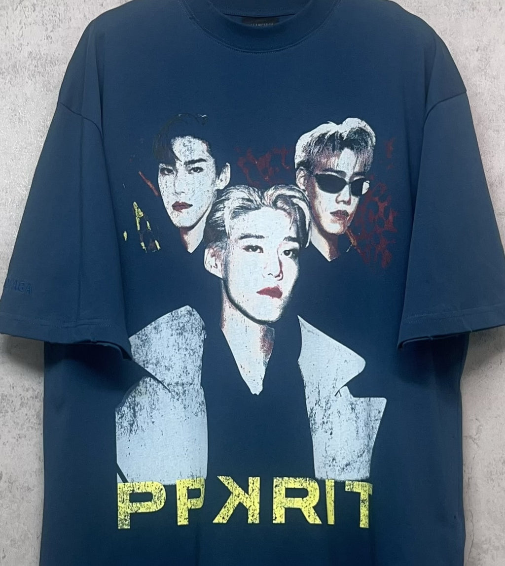 Blue graphic T-shirt close-up with three portraits and PPXPRIT text