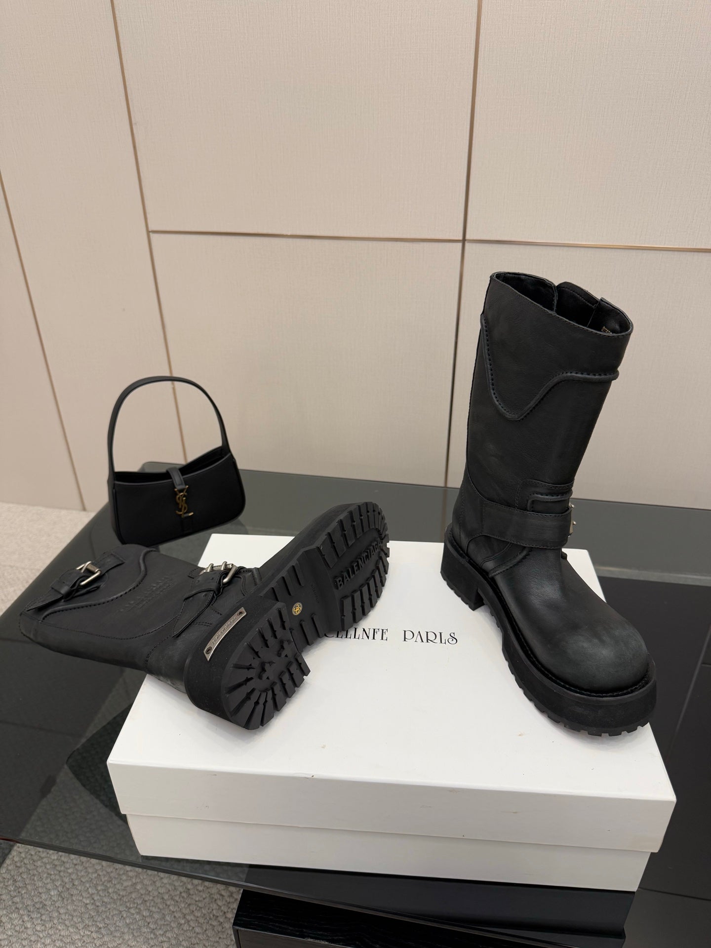 Balenciaga women's black boots with wraparound straps and rugged tread sole