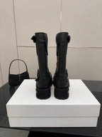 Balenciaga women's black mid-calf boots with back pull tabs and chunky tread soles