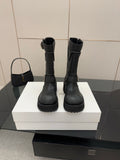 Balenciaga women's black mid-calf boots with strap buckles and chunky rubber sole