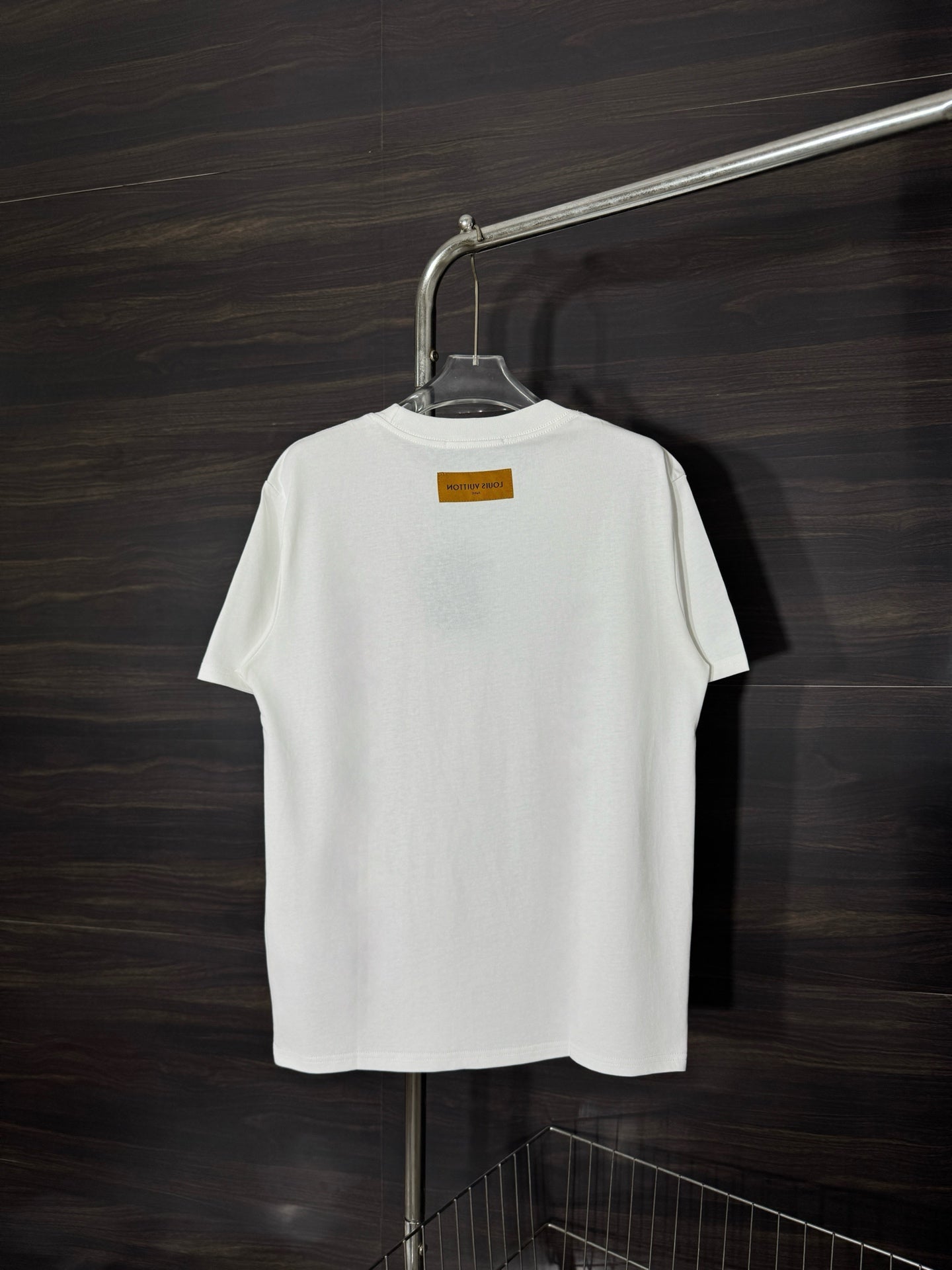 White crewneck T-shirt on hanger with small neck label on back