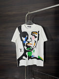 White graphic T-shirt with colorful face illustration on front