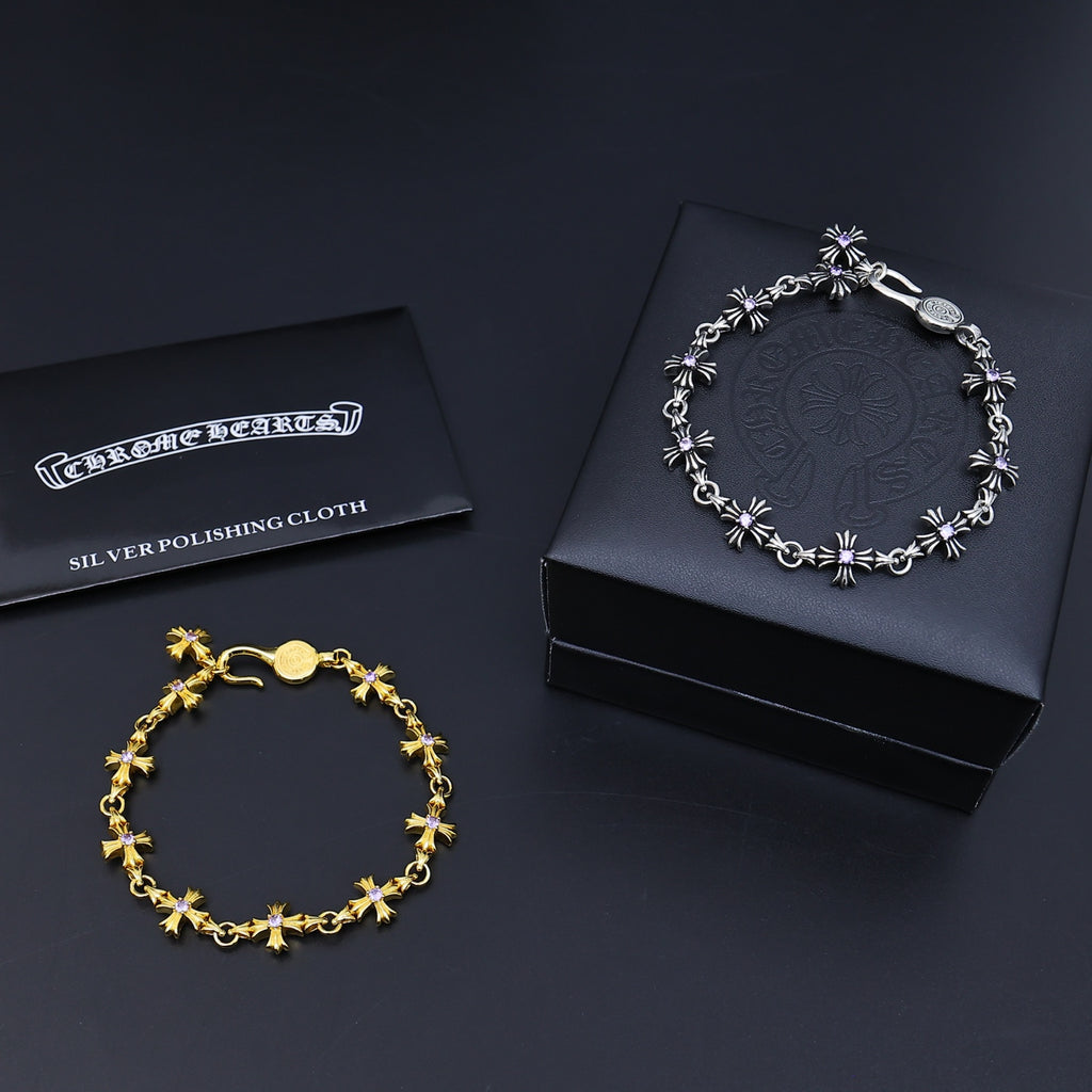 Silver and gold charm bracelets with purple accents and silver polishing cloth