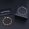 Silver and gold charm bracelets with purple accents and silver polishing cloth