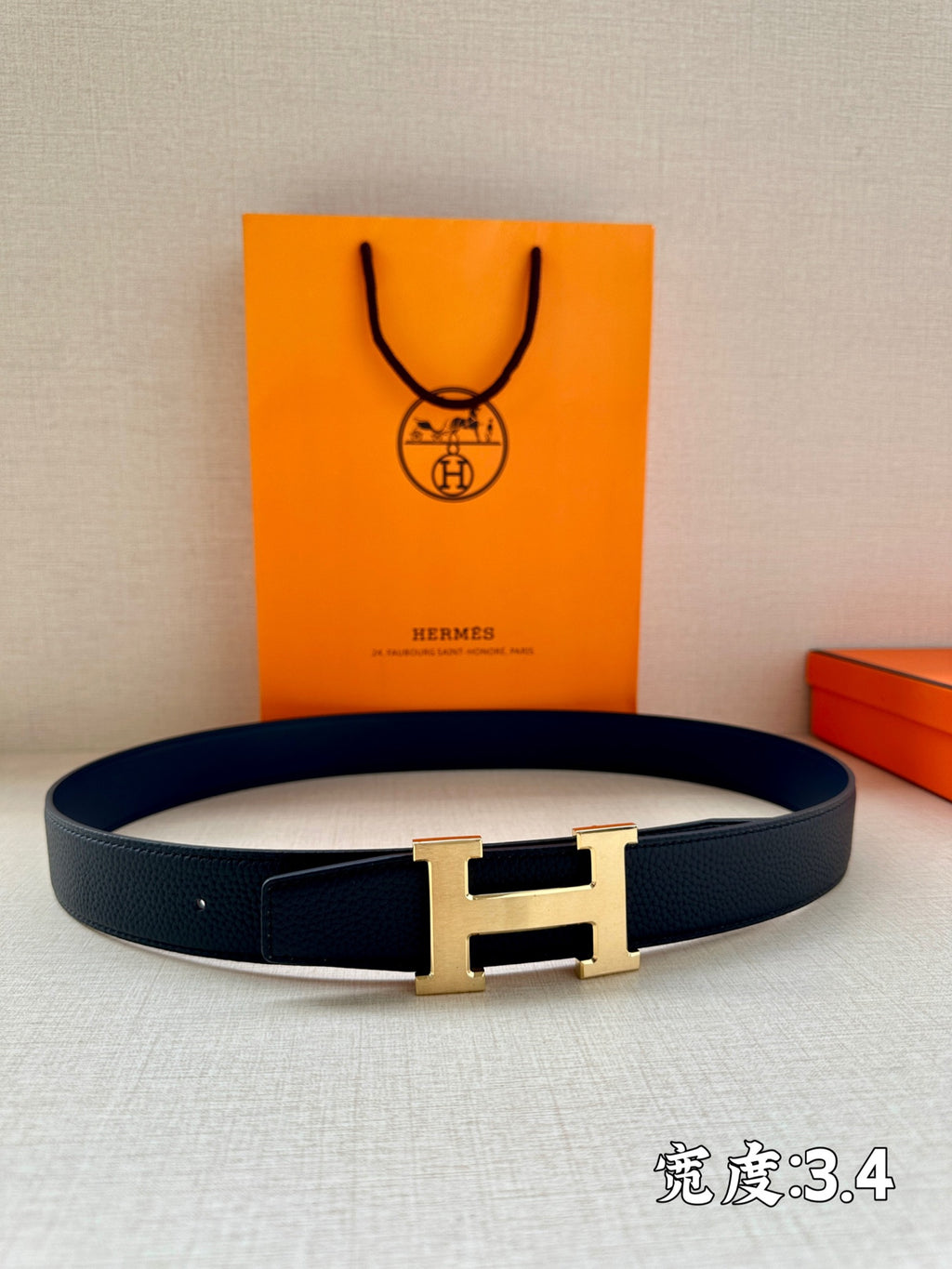 Hermes H-buckle belt in dark navy leather with gold-tone buckle hardware