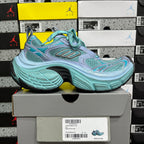 Teal and light blue mesh athletic sneakers with lace-up front and thick sole