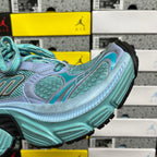 Teal and light blue athletic sneaker side view with chunky sole