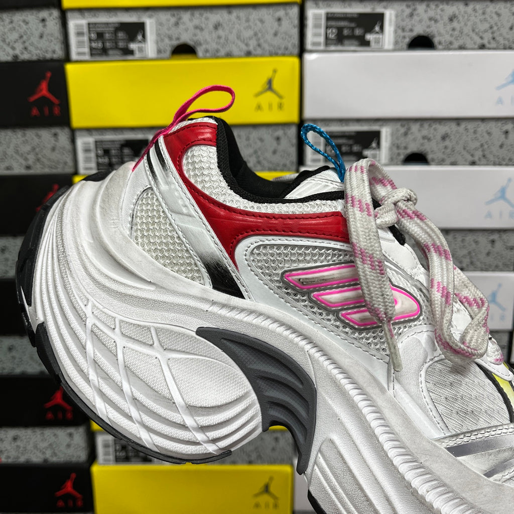 Balenciaga unisex sneakers, front view with red collar, pink logo, and multicolor laces