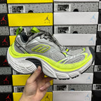 Grey and neon yellow running sneaker, lace-up front with chunky sole