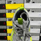 Grey running sneaker heel and laces, neon yellow collar and pull tab