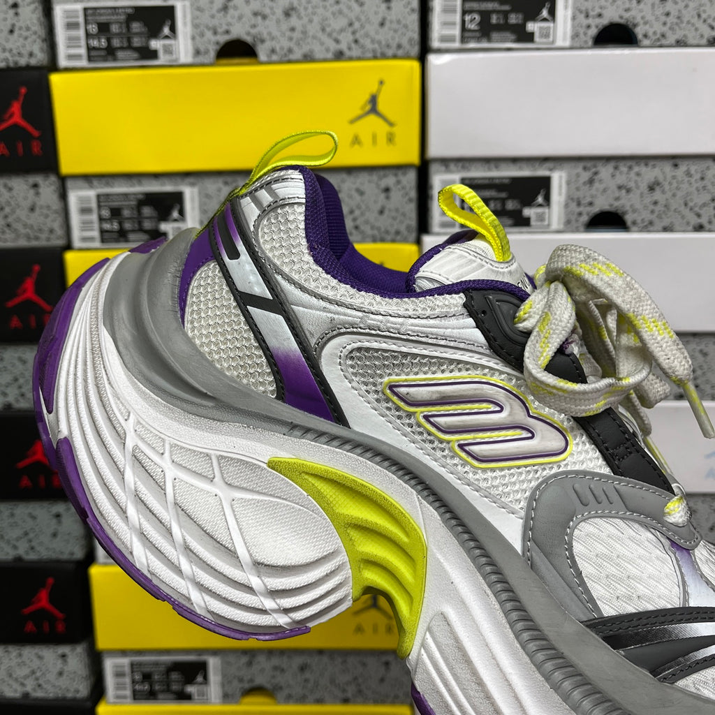 Low-cut lace-up sneakers with gray upper, purple stripe, and neon lime accents