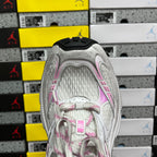 White sneaker heel with pink-trim details and textured interior lining