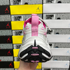 White sneaker outsole with black traction and pink accent pods at heel