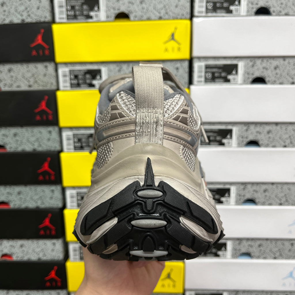 Light gray sneaker outsole with rugged tread pattern and molded traction zones