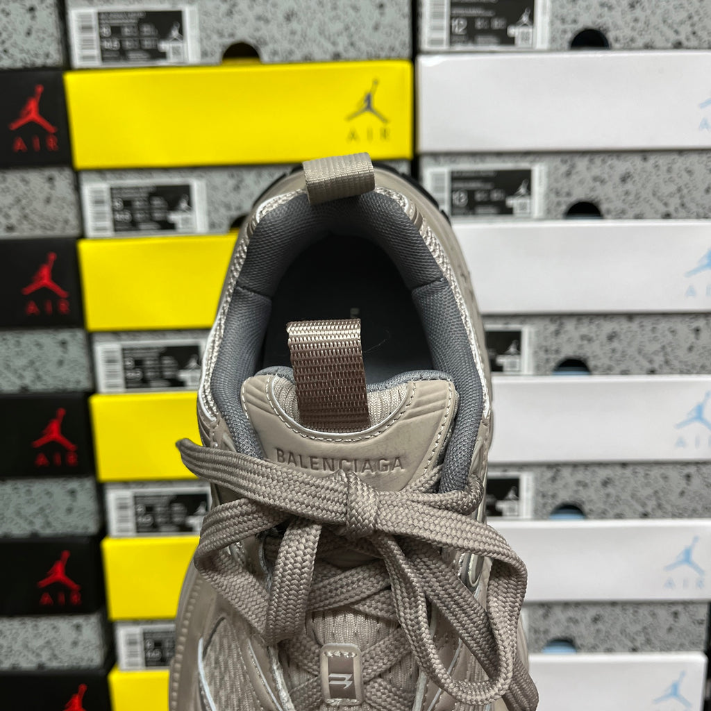 Light gray sneaker heel with woven pull tab and embossed Balenciaga logo