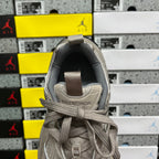 Light gray sneaker heel with woven pull tab and embossed Balenciaga logo