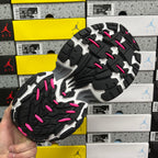 Balenciaga sneakers outsole close-up, black rubber tread with pink accents and white inserts