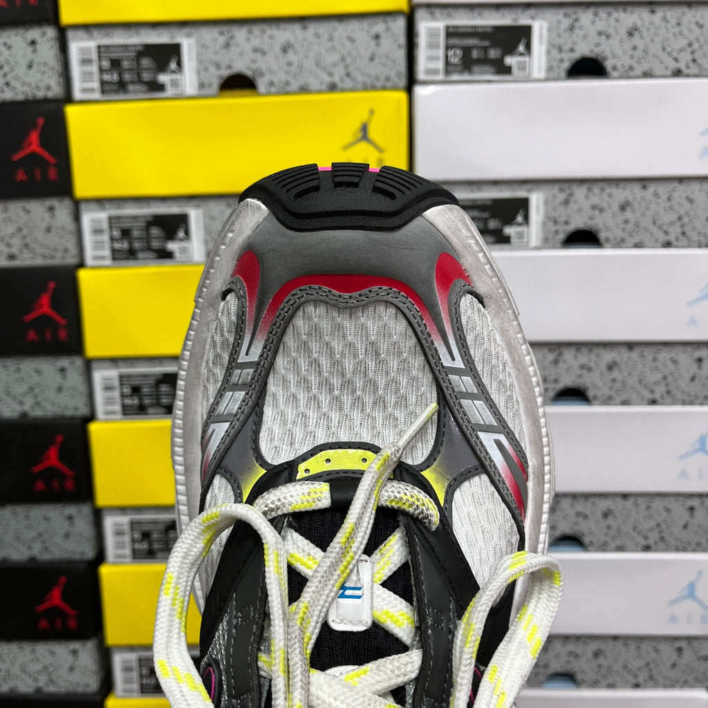 Balenciaga sneakers heel view, gray textile upper, black trim, red and lime accents