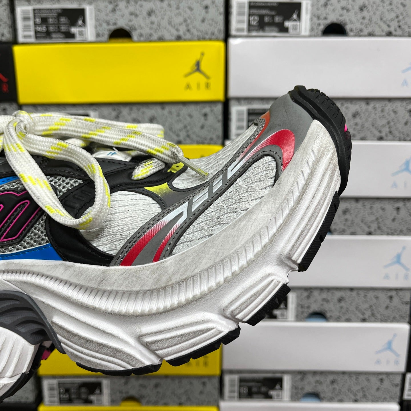 Balenciaga sneakers side view, white midsole, light gray upper, red detail, neon laces
