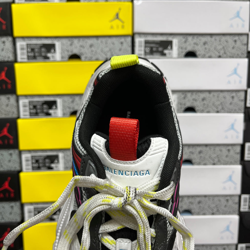 Balenciaga sneakers back view, black heel tab, red patch, white trim, BALENCIAGA logo