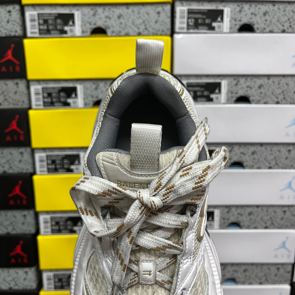 White Balenciaga sneakers with fabric tongue strap, lace-up front and padded collar.
