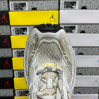 White Balenciaga sneakers heel view with textured collar and padded ankle lining.