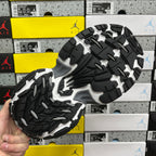 Sneaker outsole with black and gray traction tread, chunky platform base.