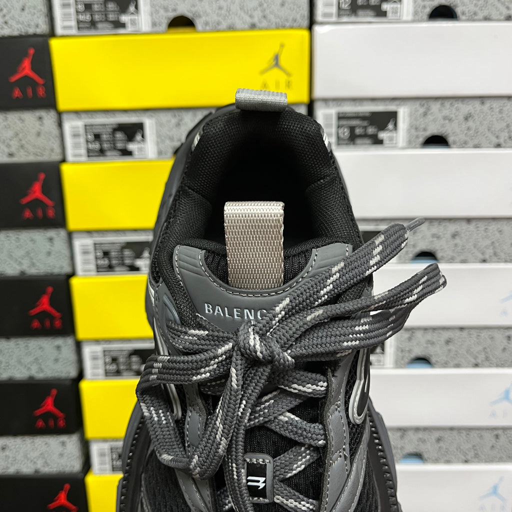 Balenciaga unisex sneaker tongue with BALENCIAGA logo label and gray lace ties, dark gray