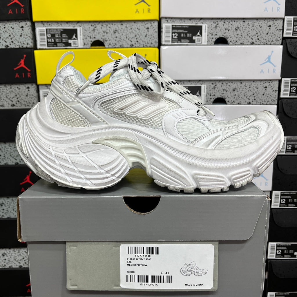 White Balenciaga chunky sneaker with lace-up front, mesh panels, and embossed details