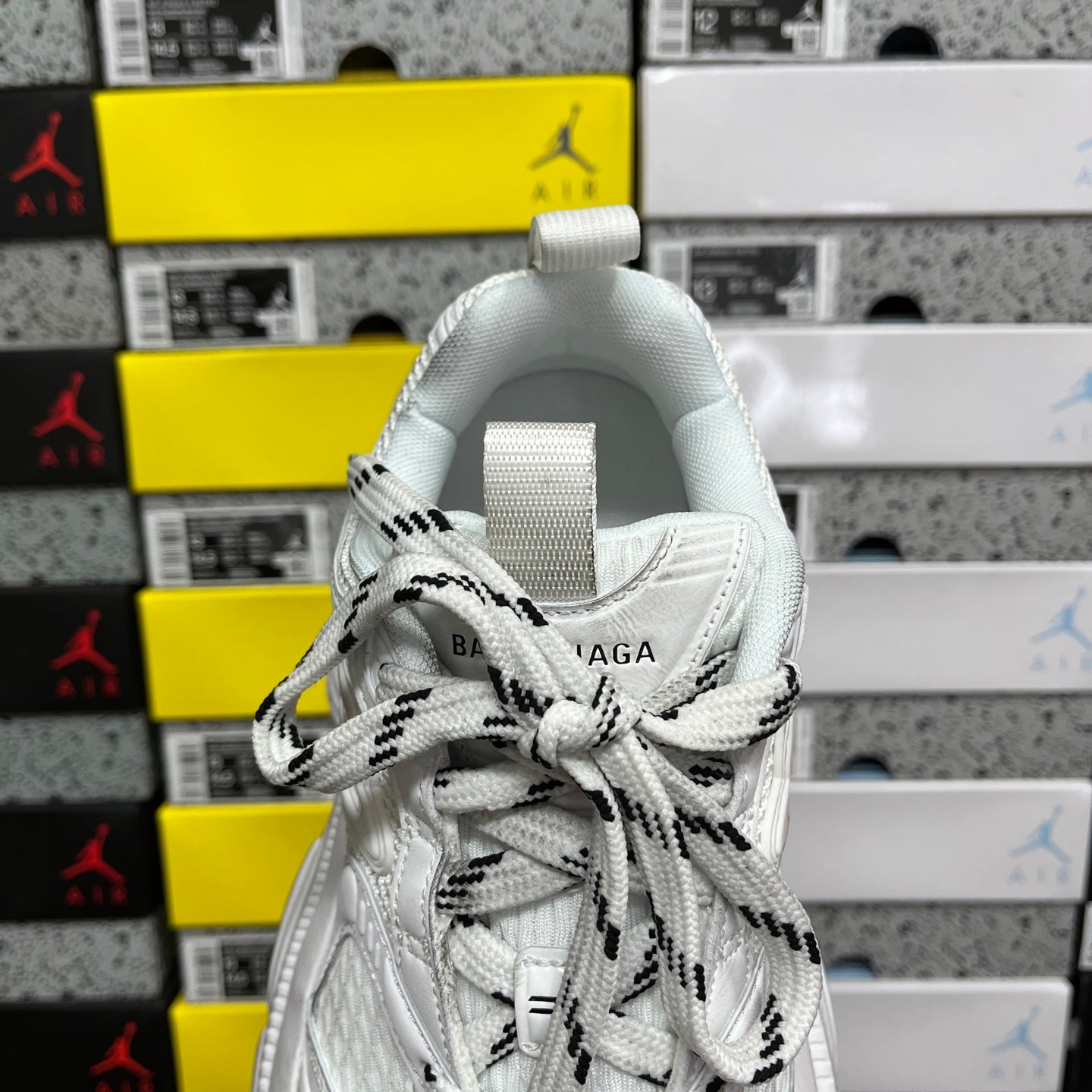 White Balenciaga sneaker back with fabric pull tab and lace-up vamp