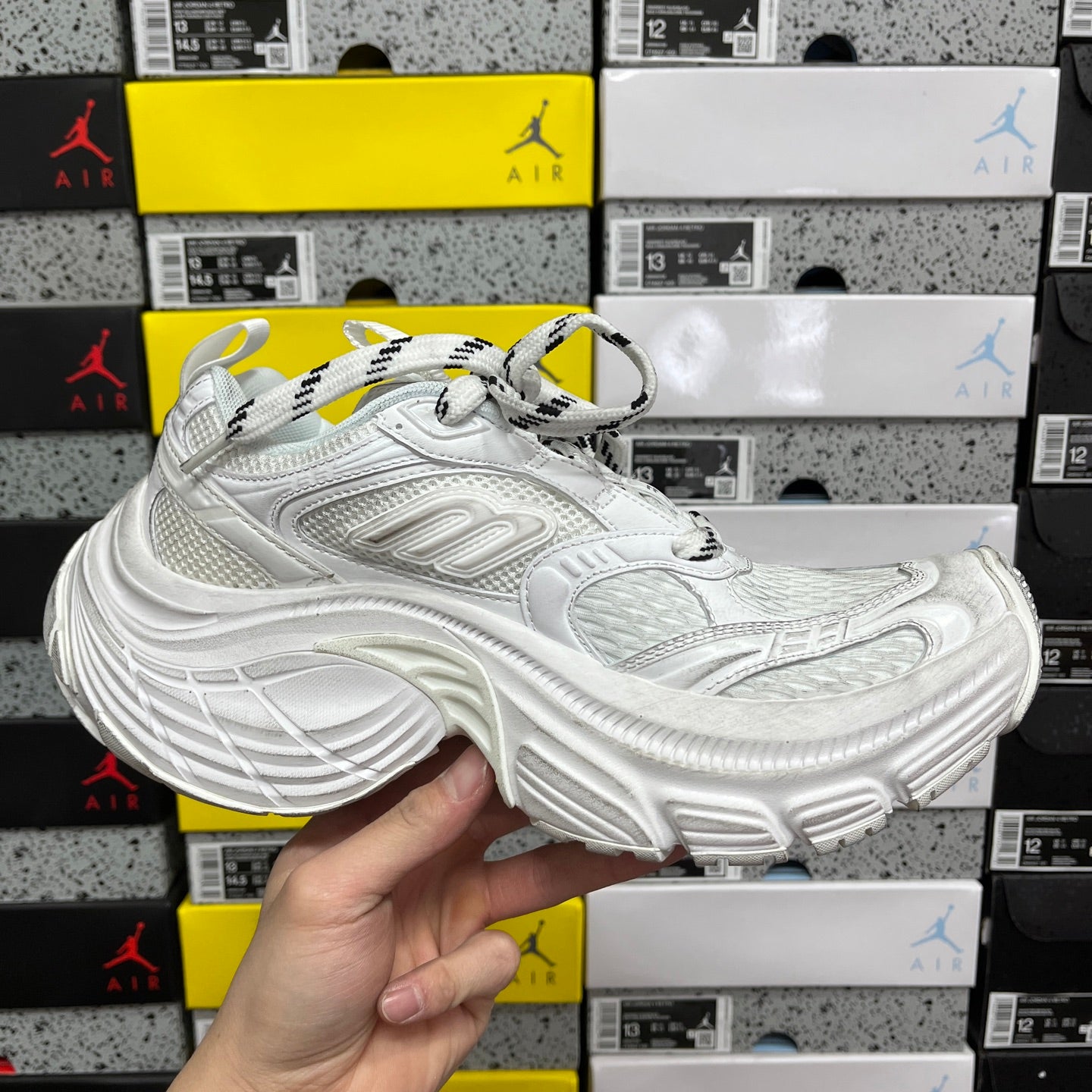 White Balenciaga lace-up dad sneaker with thick sole and side embossed detailing