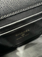 Black Chanel bag base with embossed CHANEL and MADE IN ITALY text