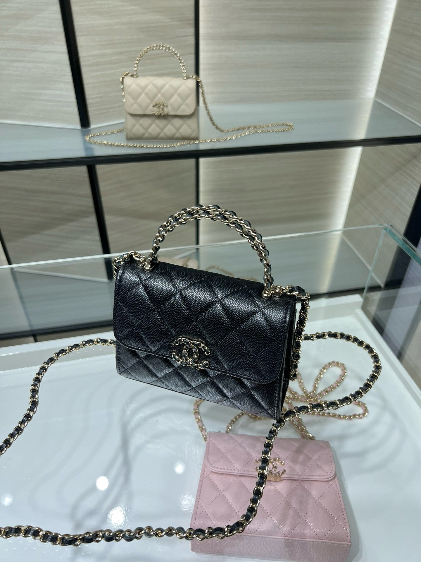 Black quilted Chanel shoulder bag with chain handle strap and front flap closure