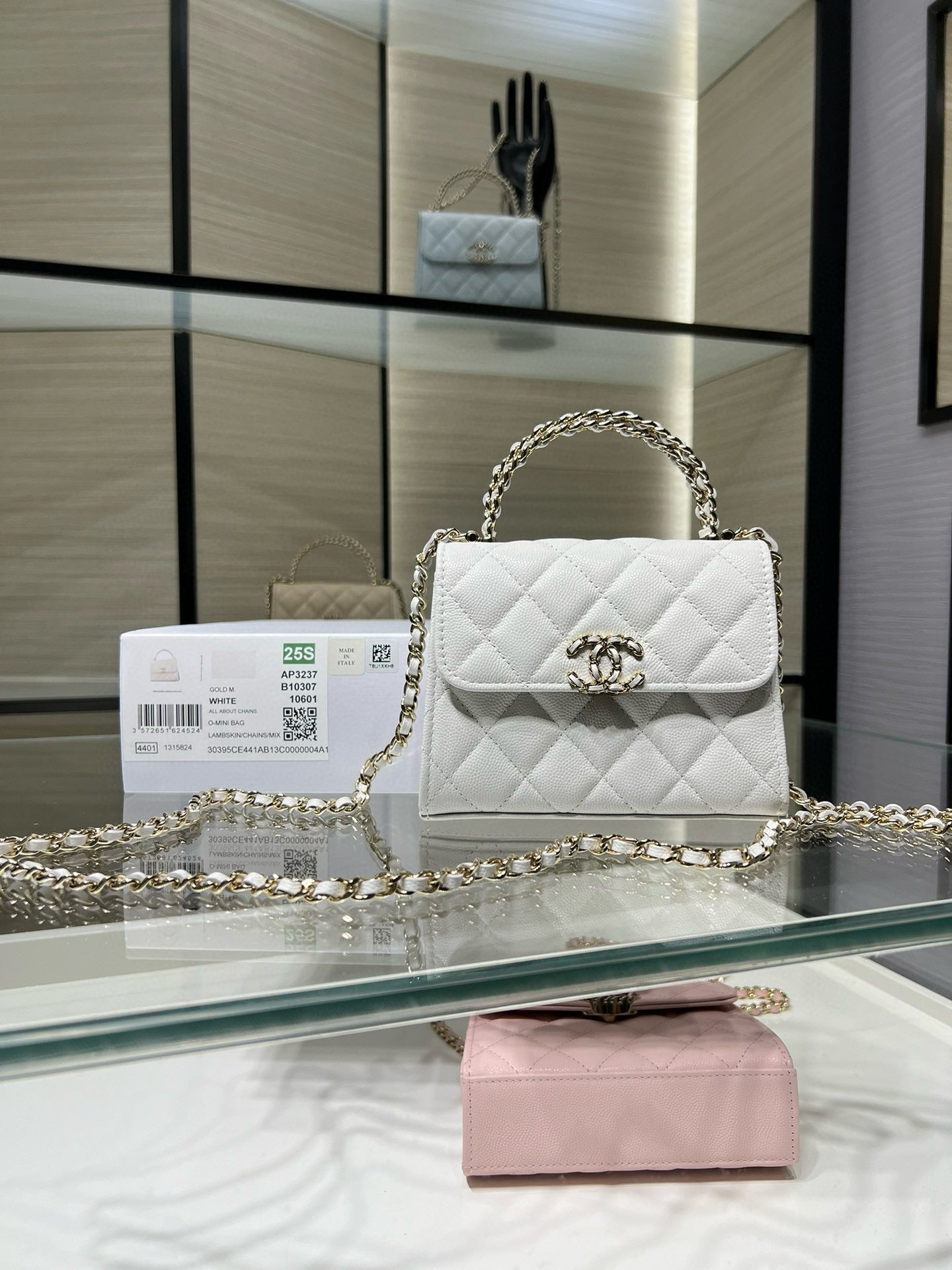 Chanel quilted white leather flap bag with gold chain strap and turn-lock clasp