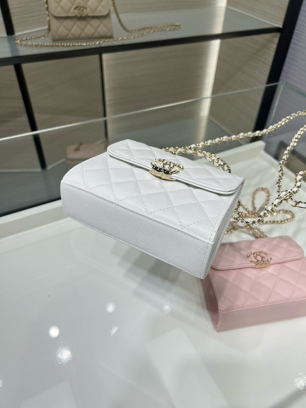 Chanel white quilted leather mini flap bag with gold chain strap and front clasp