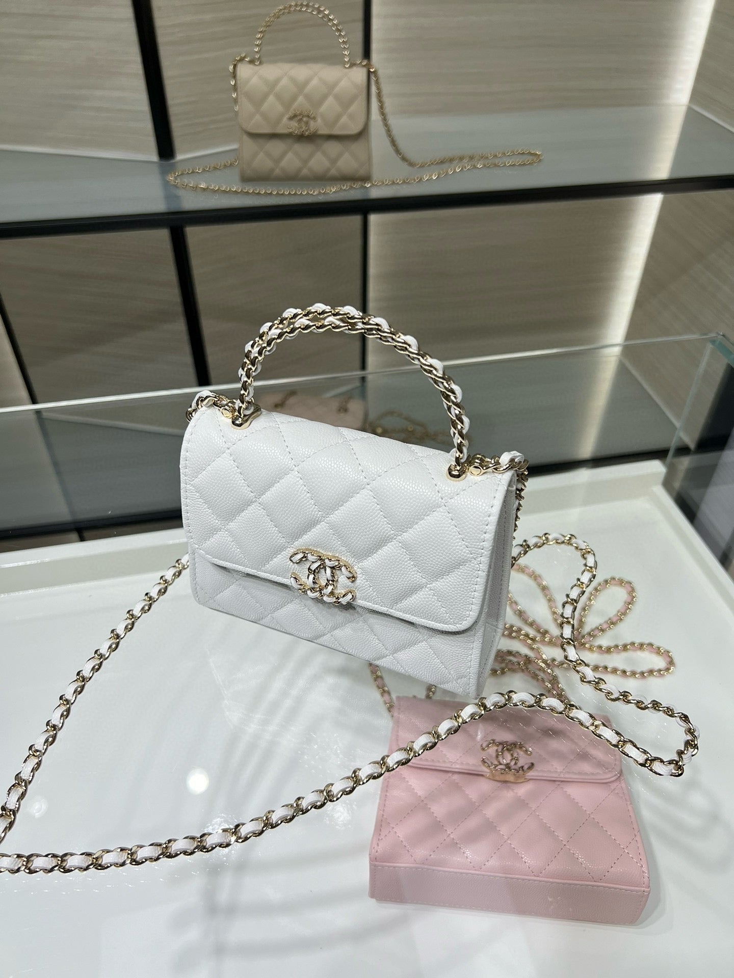 Chanel quilted white leather mini flap bag with gold chain strap and turn-lock clasp