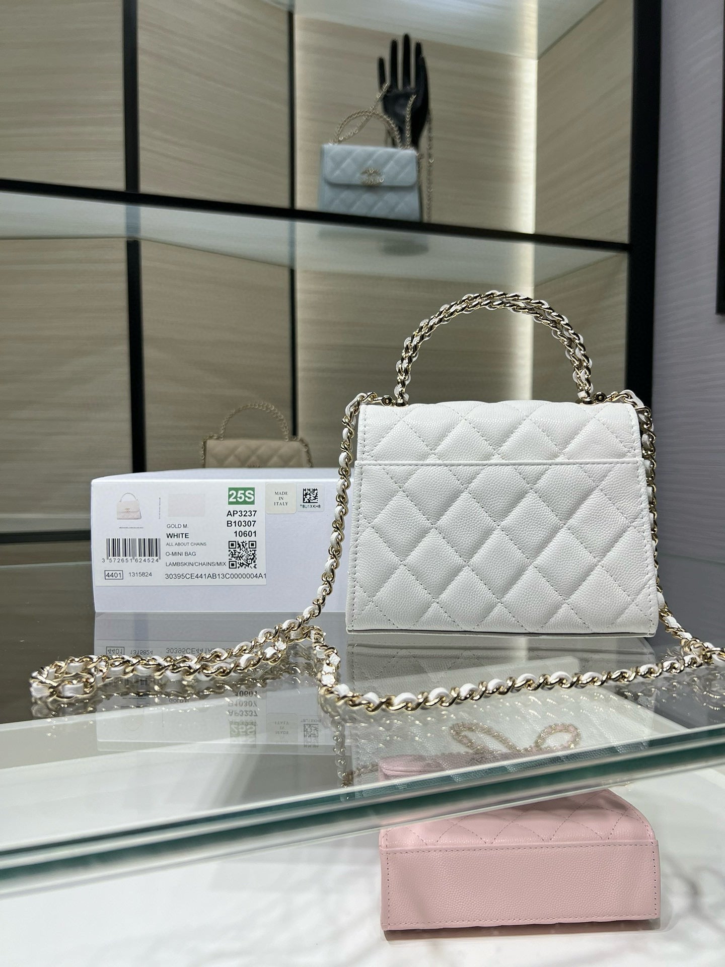 Chanel quilted white leather mini flap bag with gold chain strap and turn-lock clasp