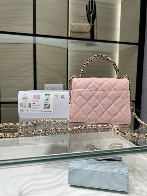 Pink quilted mini handbag with gold-tone chain strap and front flap clasp